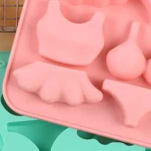 Close-up detail of a pink silicone swimsuit mold for DIY fondant cake decoration