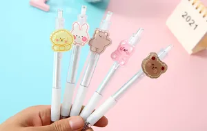 Macro view of student retractable gel pens featuring adorable cartoon animal patches
