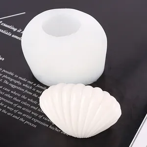 Close-up detail of a white seashell silicone mold with a finished decorative resin shell