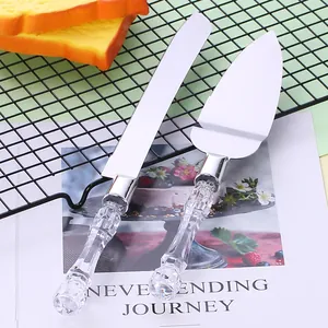 Elegant stainless steel cake knife and server set featuring clear crystal cut handles for baking