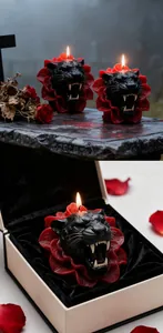 Détail d'une bougie parfumée en forme de panthère noire dans un coffret cadeau