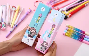 Detailed view of two cute surprise blind box pen packages with cartoon girl illustrations