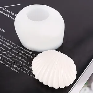 Detailed view of white shell silicone mold and finished aromatherapy candle object
