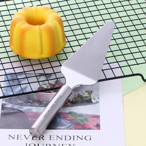 Stainless steel pizza server and cake shovel with Food Network engraving for baking.