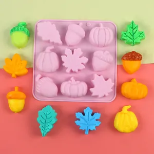 Detailed view of 9-cavity silicone mold featuring colorful pumpkin, acorn, and maple leaf candy