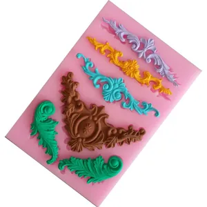 Close-up of ornate baroque style silicone fondant mold showing colorful clay details