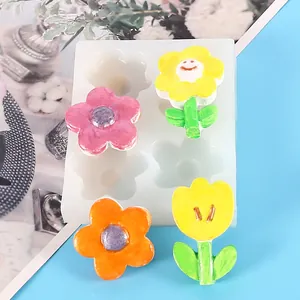 Vista detallada de un molde de silicona con flores de colores terminadas