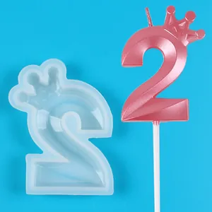 Detailed view of crown number 2 silicone mold with finished pink metallic candle