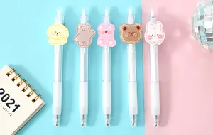 Detailed view of five cartoon animal retractable gel pens on pink and blue background