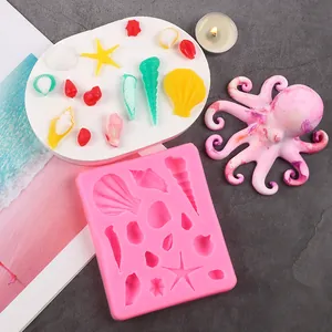 Detailed macro view of pink ocean seashell silicone mold with colorful DIY fondant crafts