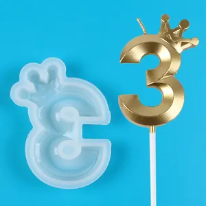 Detail view of crown number 3 silicone mold and gold birthday candle