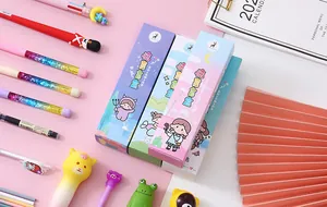 Detailed macro view of colorful surprise blind box pens with illustrated packaging