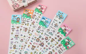 Close-up of colorful waterproof cartoon stickers with cute girl characters for DIY journals.