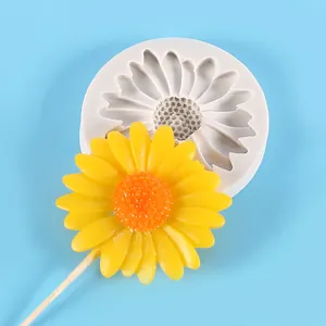 Detailed view of a sunflower silicone mold and its finished yellow flower decoration