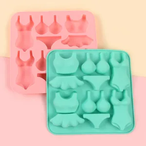 Detail of swimsuit and bikini shaped silicone molds for fondant and chocolate decoration.