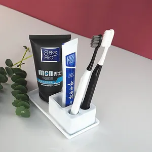 Detailed view of white marble pattern toothbrush and toothpaste holder tray set
