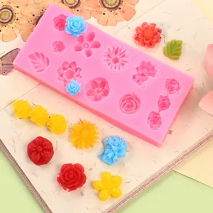 Detailed view of multi-flower silicone mold with colorful resin rose and daisy samples