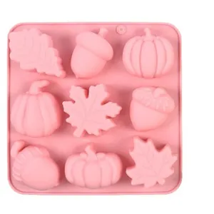 Pink 9-cavity Halloween silicone mold featuring pumpkin, maple leaf, and acorn shapes