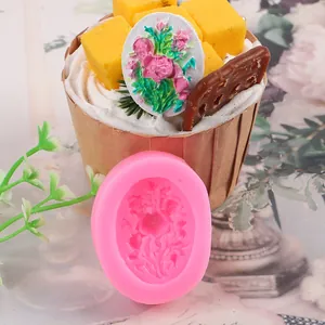 Close-up of pink 3D rose silicone mold showing detailed floral fondant decoration