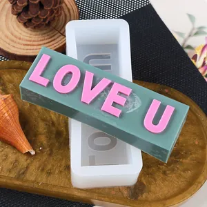 Detail view of rectangular silicone mold with LOVE U letters for candle making