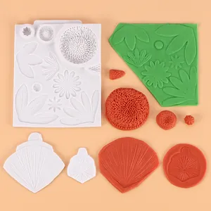 Close-up of sunflower silicone molds with various finished gum paste floral impressions
