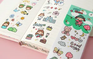 Detail of cute cartoon waterproof PVC stickers applied on a decorative notebook page