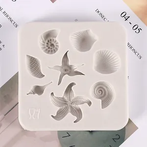 Detailed view of ocean-themed silicone mold with starfish and seashell cavities