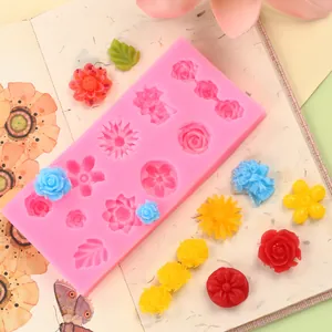 Close-up of pink silicone flower mold showing various floral designs and samples
