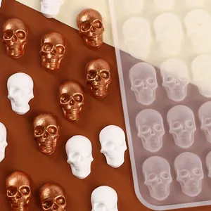 Macro detail of skull-shaped silicone mold with finished chocolate and candy skulls.