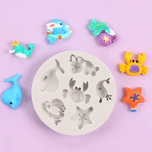 Detailed macro view of a sea animal silicone mold with colorful finished resin figures
