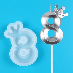 Top-down detail shot showing a translucent crown number 8 mold and its silver candle