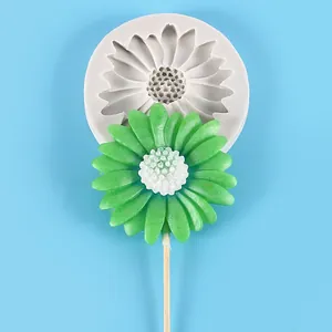 Detail view of flower silicone mold showcasing a finished green daisy lollipop decoration