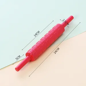 Red plastic heart pattern embossed rolling pin for baking shown with dimensions