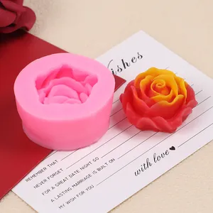 Detailed macro view of pink rose silicone mold next to a colorful wax flower on a card