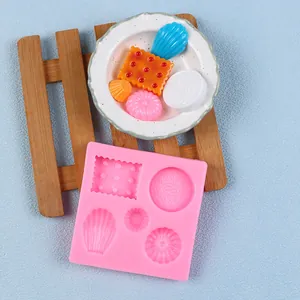 Pink silicone fondant mold with seashell and biscuit shapes for DIY baking
