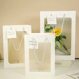 Set di 3 sacchetti regalo in carta bianca con finestra e manici in corda