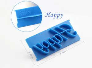 Close-up detail of blue 'Happy' cursive fondant stamp showing 6.5x3.0cm product dimensions