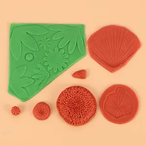 Detailed view of assorted floral leaf patterns on high quality silicone cake molds