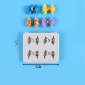 Detailansicht der weißen Silikonform für Schleifen mit Maßen 6,3x5,4 cm und bunten Mustern