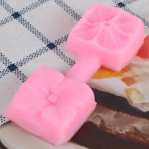 Macro detail view of pink silicone 3D flower petal fondant mold for cake decoration