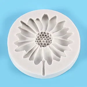 Detailed macro view of a daisy sunflower shaped silicone mold for fondant cake decoration.