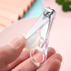 Minimalist transparent nail clipper with ergonomic circular grip and decorative accent
