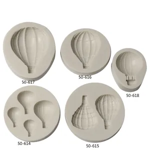 Detail view of various hot air balloon and lantern shaped silicone molds for baking