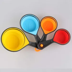 Macro view of colorful collapsible silicone measuring cups with engraved scales