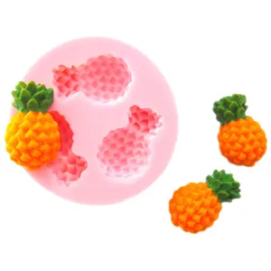 Detail view of pineapple silicone mold with finished fondant fruit examples