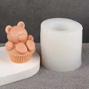 Detail view of 3D bear candle silicone mold with finished wax bear example
