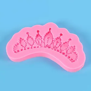 Macro view of a crown-shaped pink silicone mold for DIY fondant cake and chocolate baking