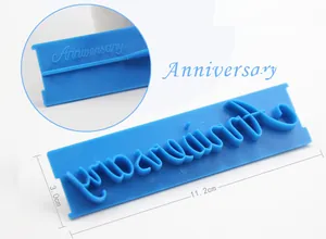 Close-up of Anniversary script fondant stamp mold for professional cake decorating