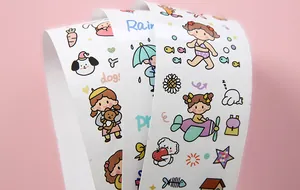 Macro view showing detailed cute Japanese style cartoon stickers for DIY journal decoration
