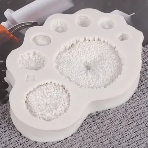 Close-up detail of sunflower texture pattern on white silicone DIY cake mold tool